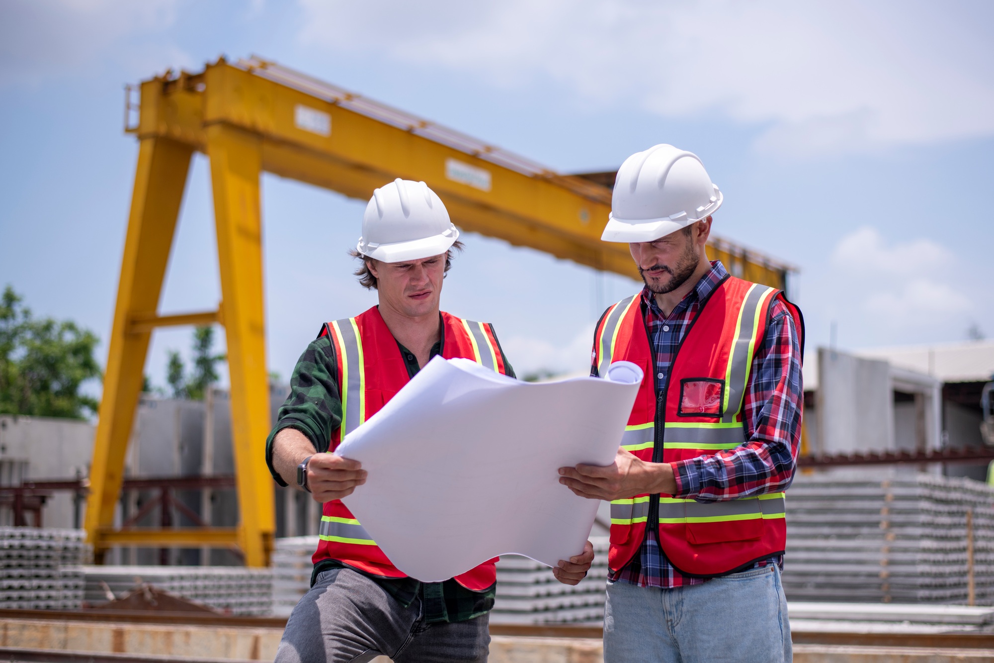 Engineer or worker architecture wearing safety uniform survey and working at structure building site